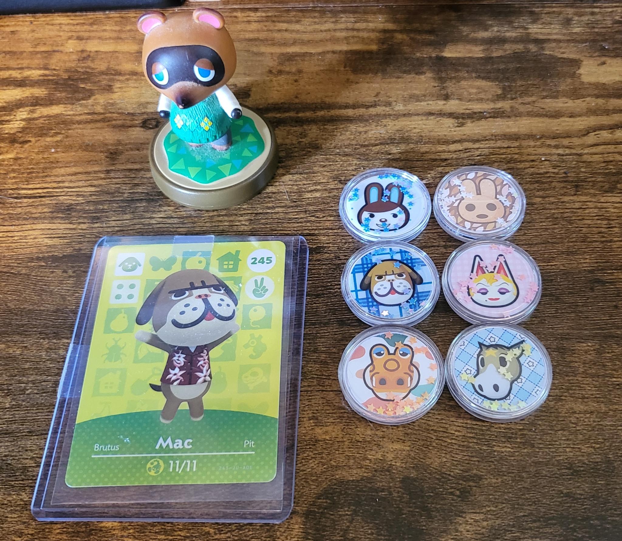 tom nook amiibo figure, mac amiibo card, and amiibo coins with sparkly glitter for carmen, coco, mac, monique, alfonso, and winnie